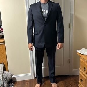 Tommy Hilfiger Blue Pinstripe Suit. Jacket: 42L. Pants: 34x32